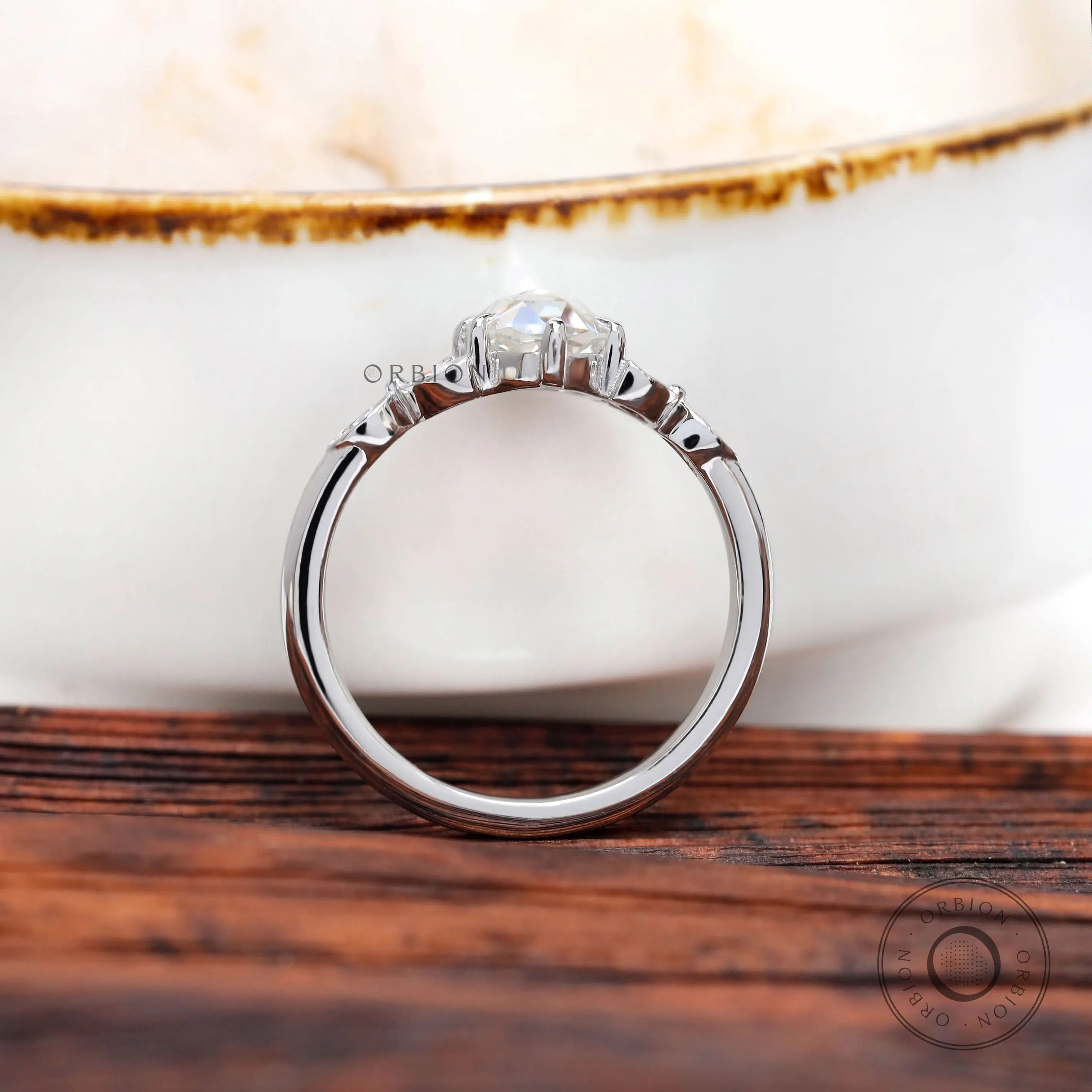 Rear view elevated oval moissanite cluster setting