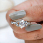 Angled view oval rose cut cluster ring design