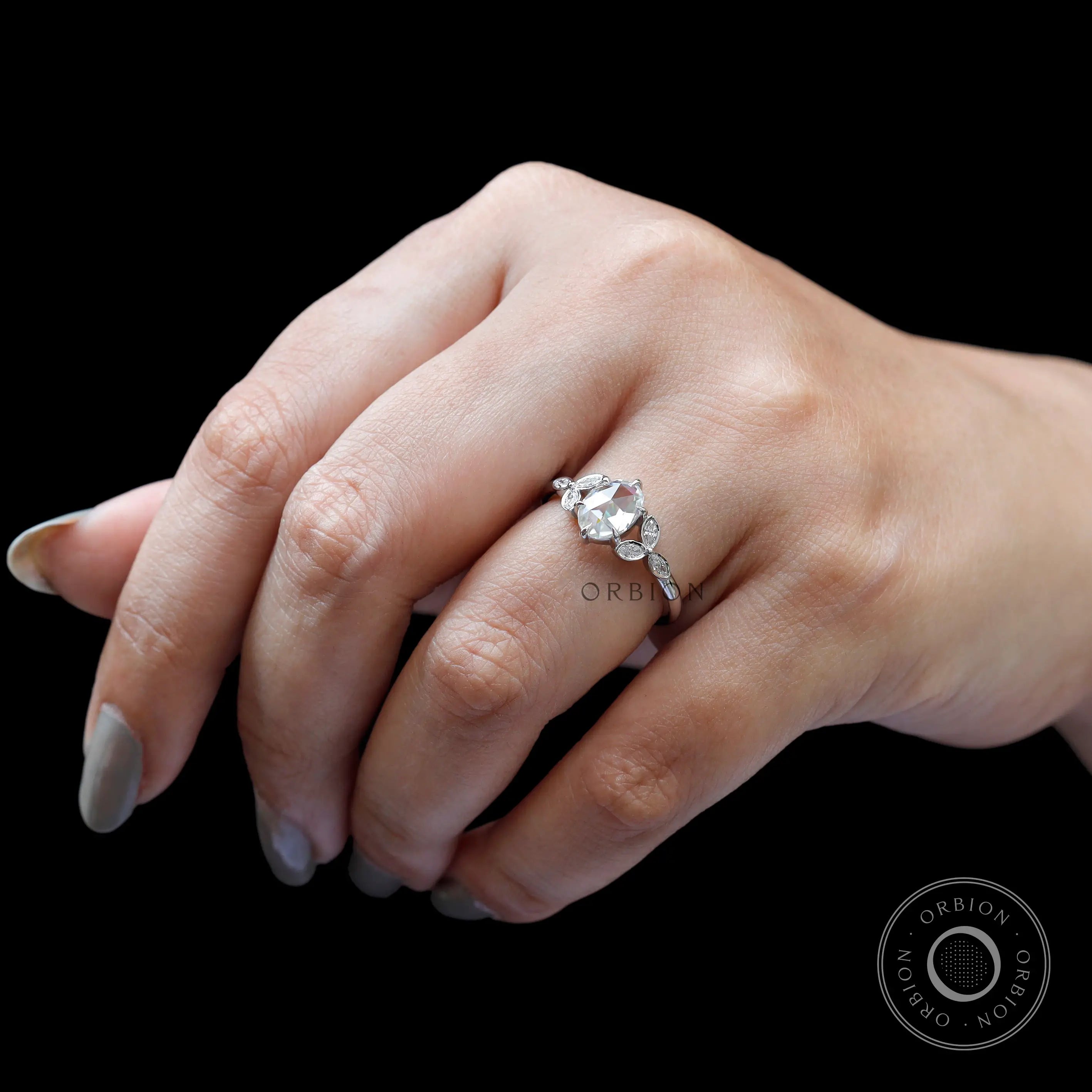 Top hand view oval rose cut cluster ring