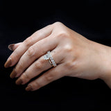 Close-up view of oval moissanite stones on band