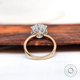 Angled view highlighting prong setting and slim gold band