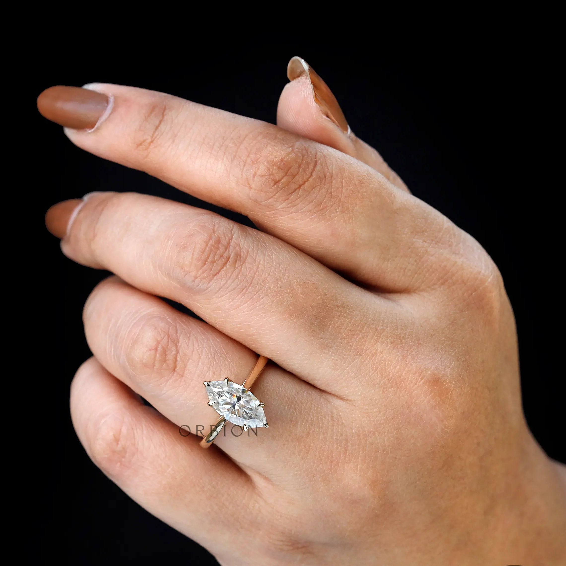 Solitaire marquise cut wedding ring yellow gold on fingure