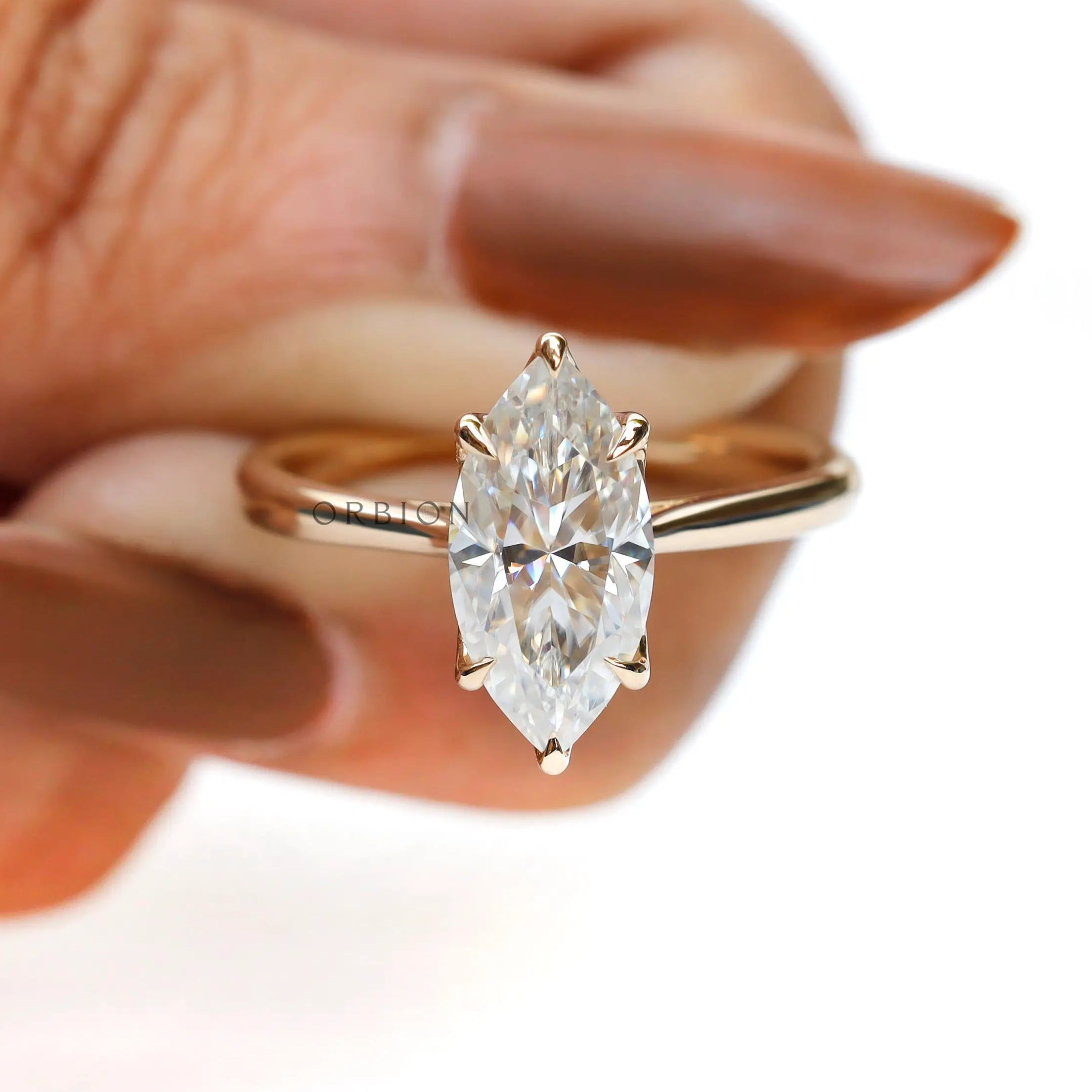 Close up tulip setting marquise engagement ring