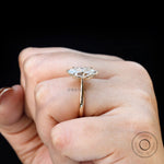 Marquise moissanite 6 prong ring on hand in yellow gold