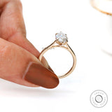 Side profile marquise engagement ring showing cathedral shank