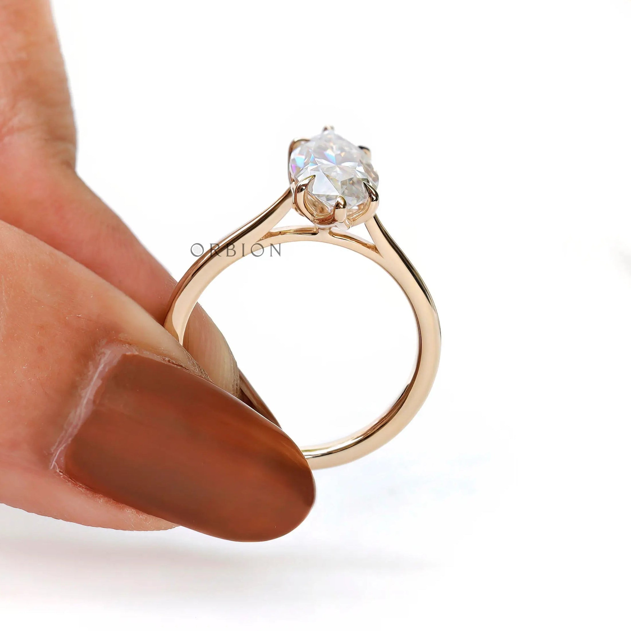 Side profile marquise engagement ring showing cathedral shank