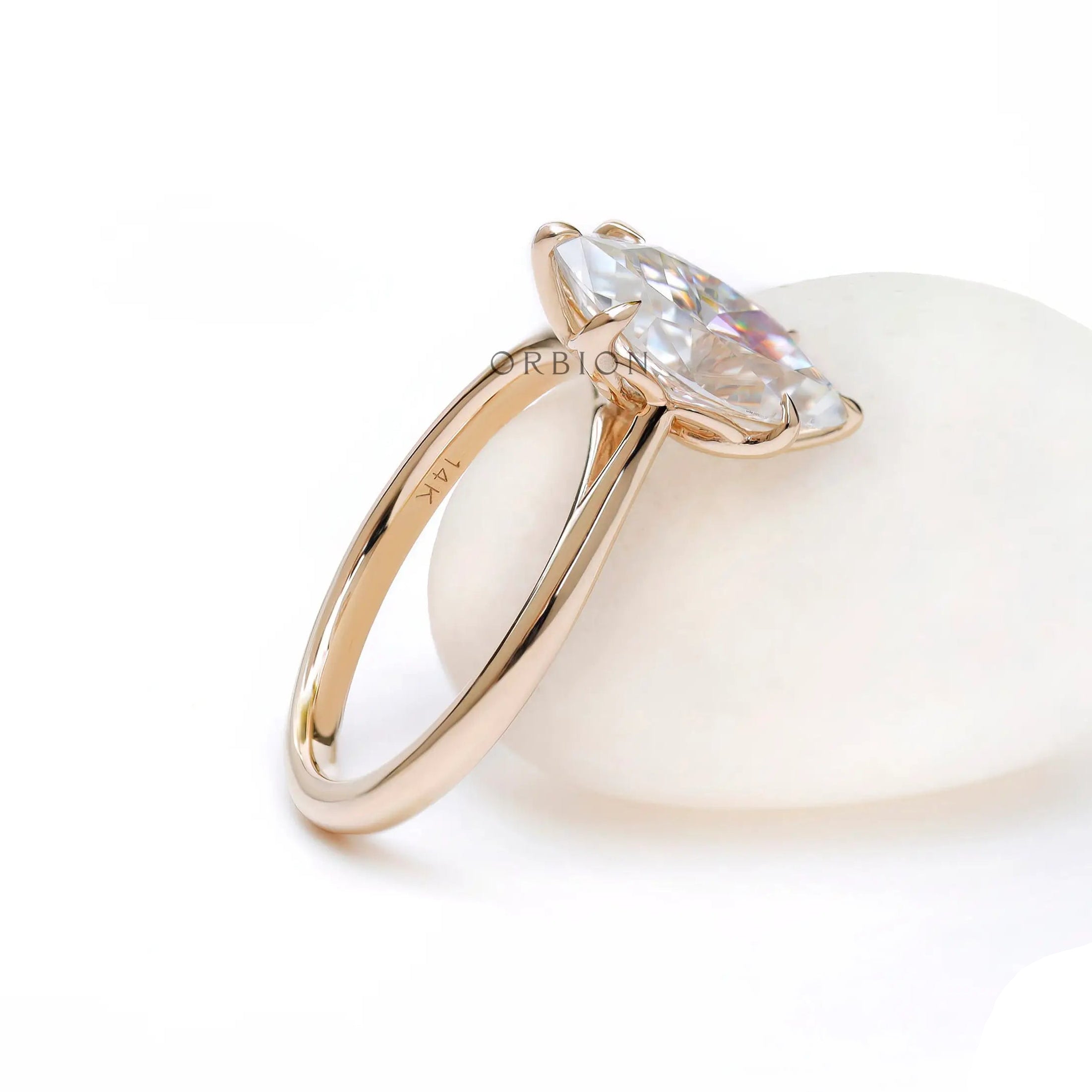 Minimal marquise cut engagement ring glossy finish