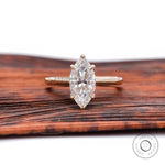 Marquise cut moissanite solitaire engagement ring in 14K yellow gold