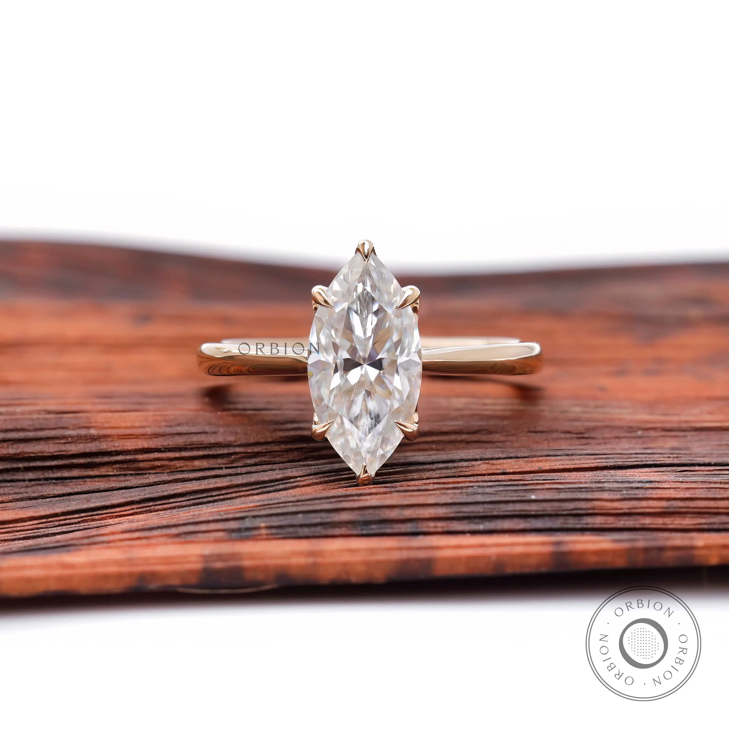 Marquise cut moissanite solitaire engagement ring in 14K yellow gold