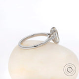 Side profile view highlighting cathedral setting and raised basket in white gold