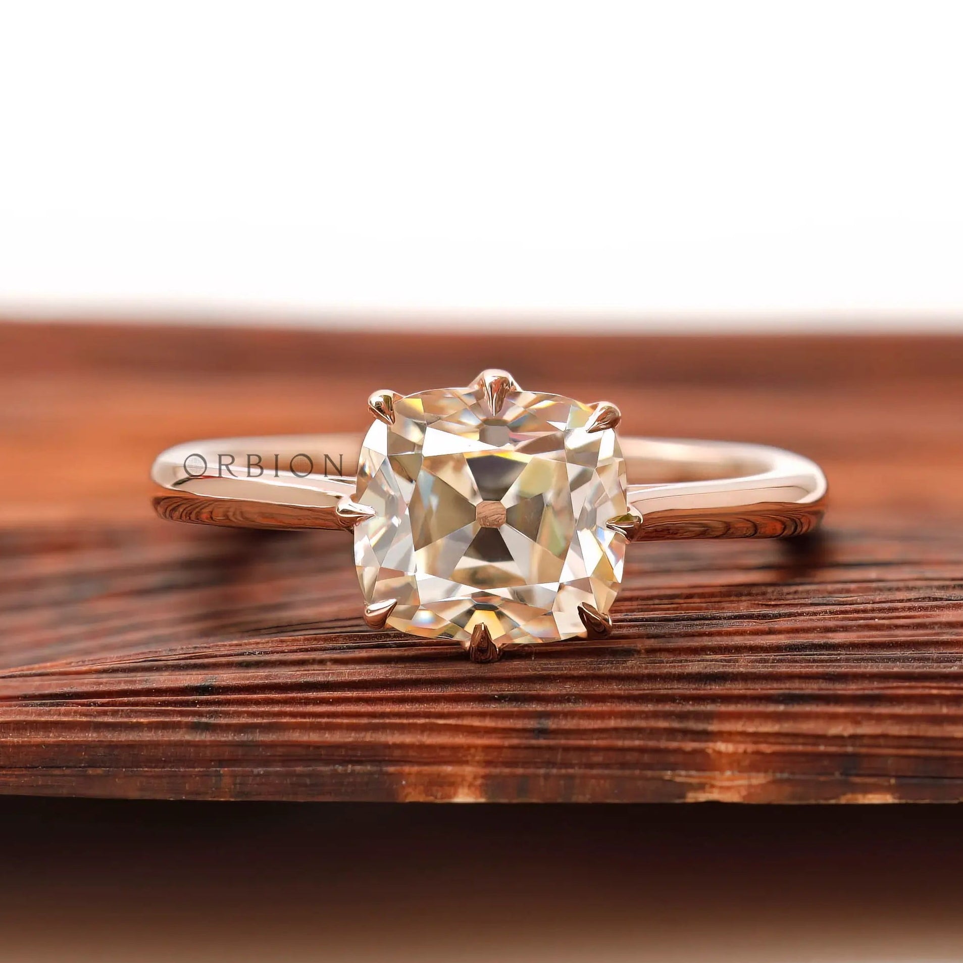 Elongated cushion Old Mine Cut moissanite solitaire ring in 14K rose gold front view