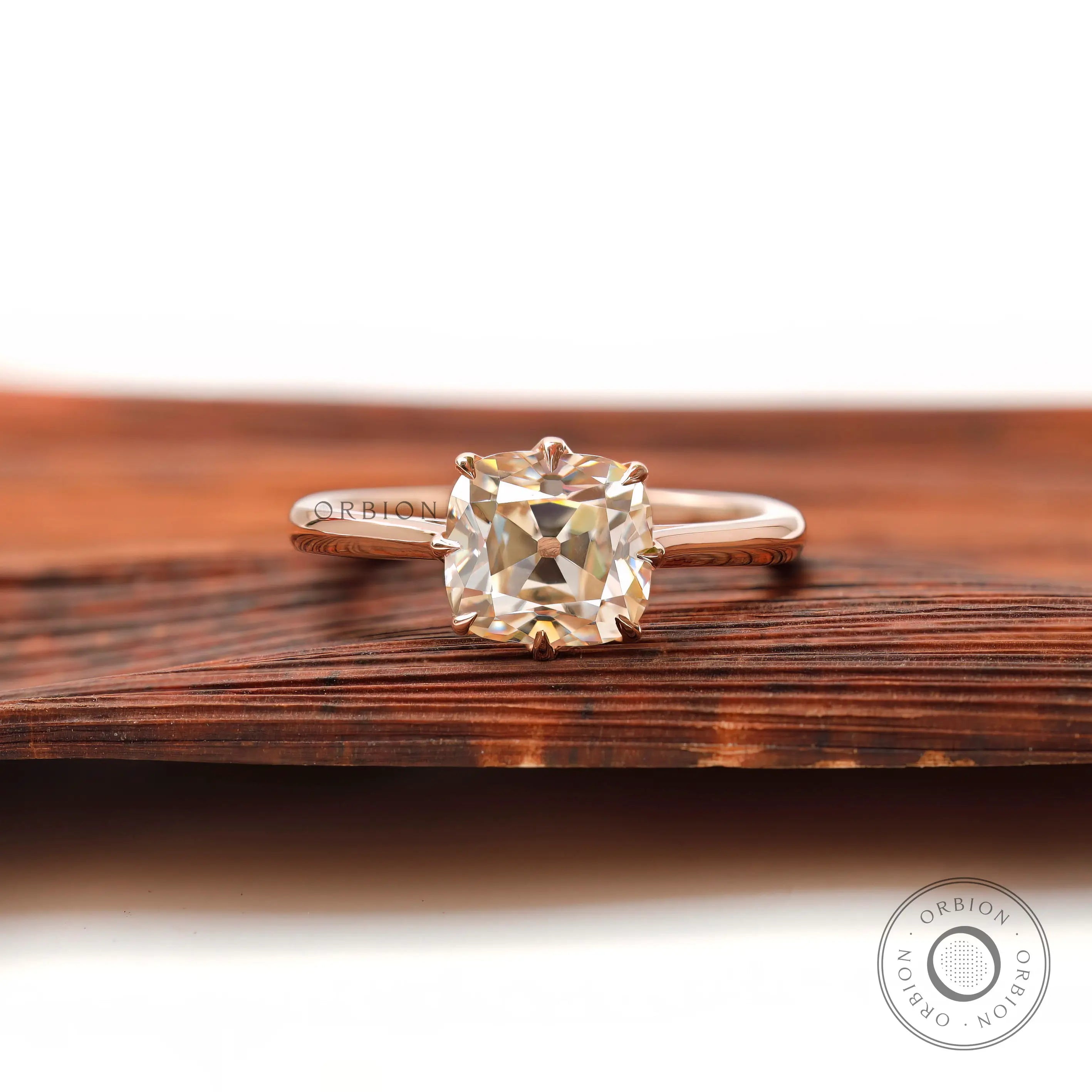 Elongated cushion Old Mine Cut moissanite solitaire ring in 14K rose gold front view