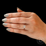 Cushion moissanite solitaire ring worn on hand