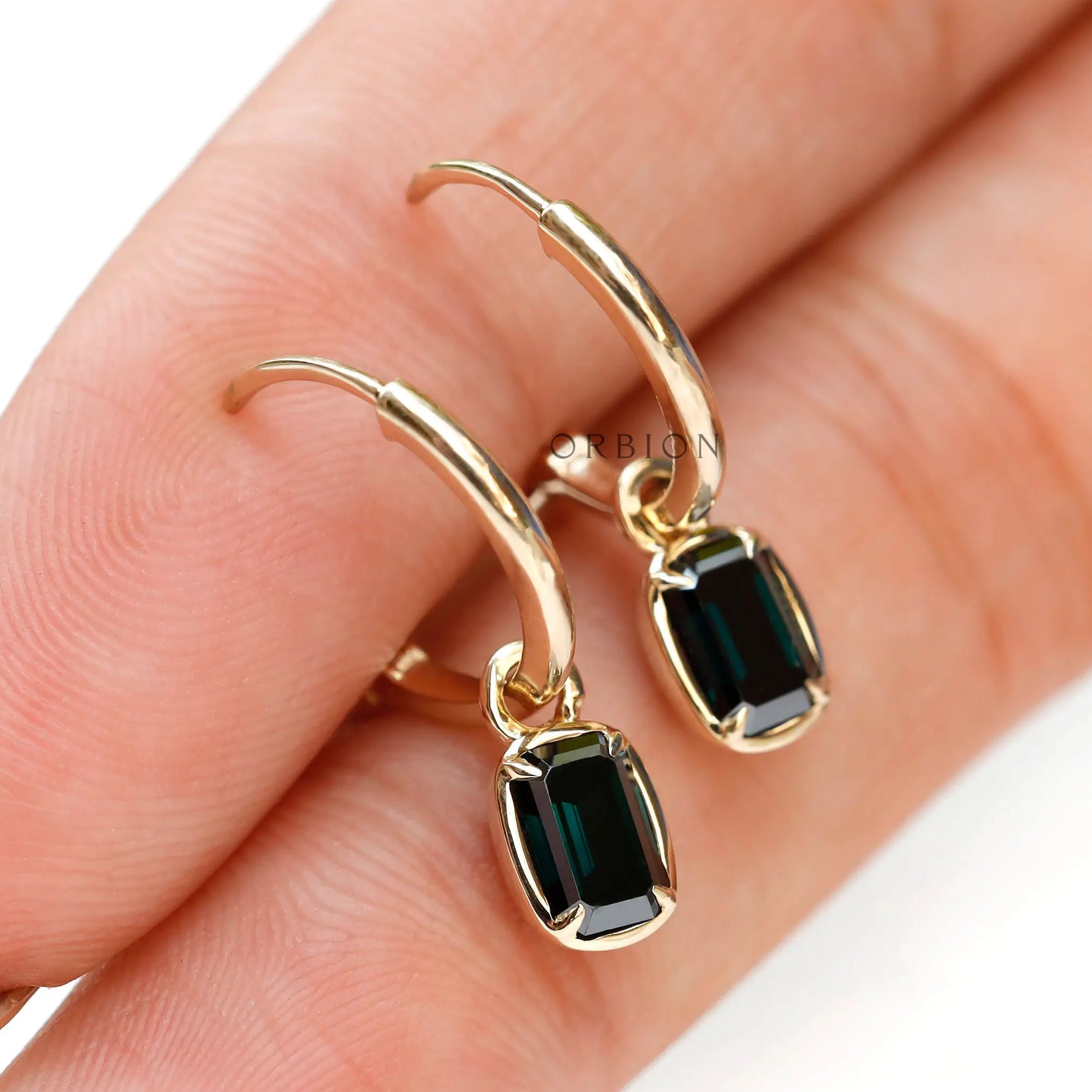 Dark green gemstone drop earrings with glossy gold finish