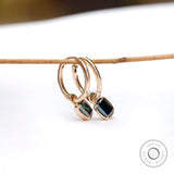 Step cut green moissanite hoop earrings detailed side view