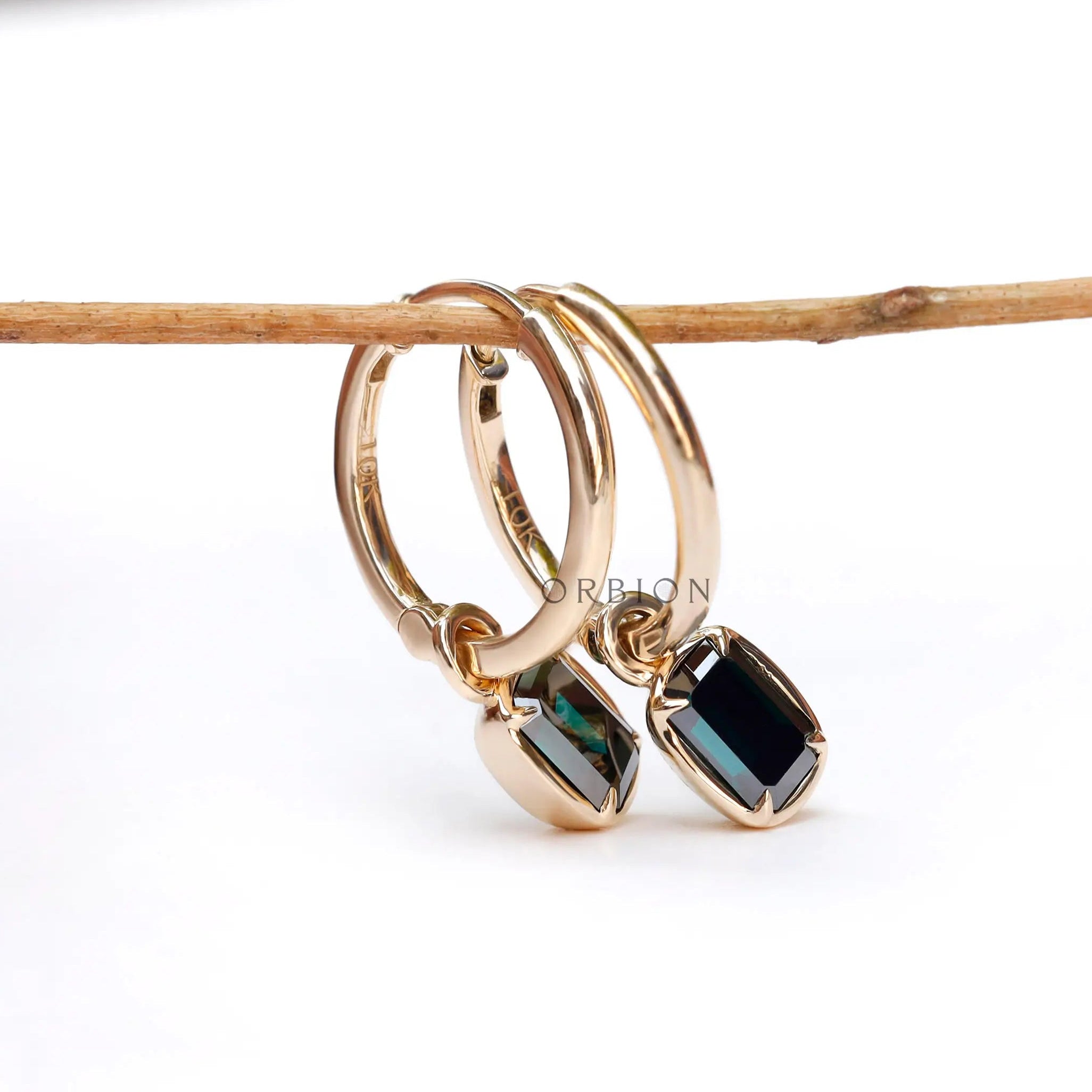 Step cut green moissanite hoop earrings detailed side view