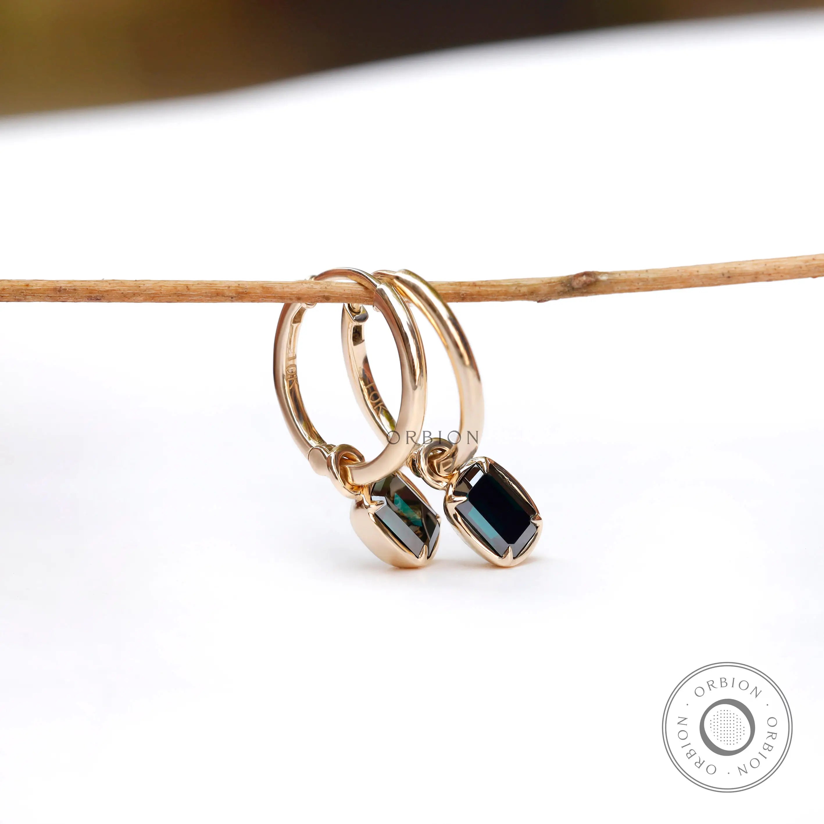 Step cut green moissanite hoop earrings detailed side view