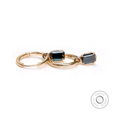 10K yellow gold huggie hoop earrings with dark green moissanite