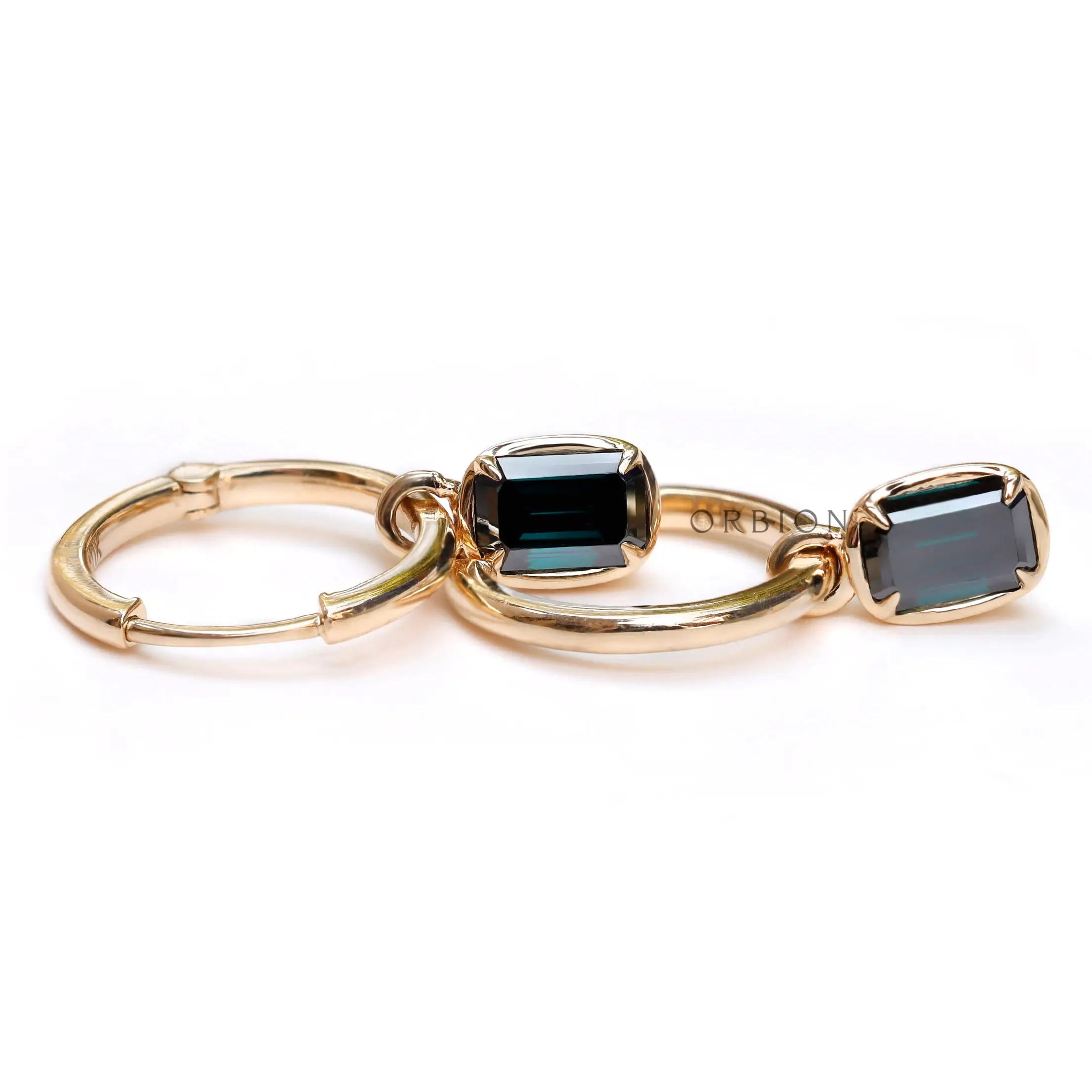 10K yellow gold huggie hoop earrings with dark green moissanite
