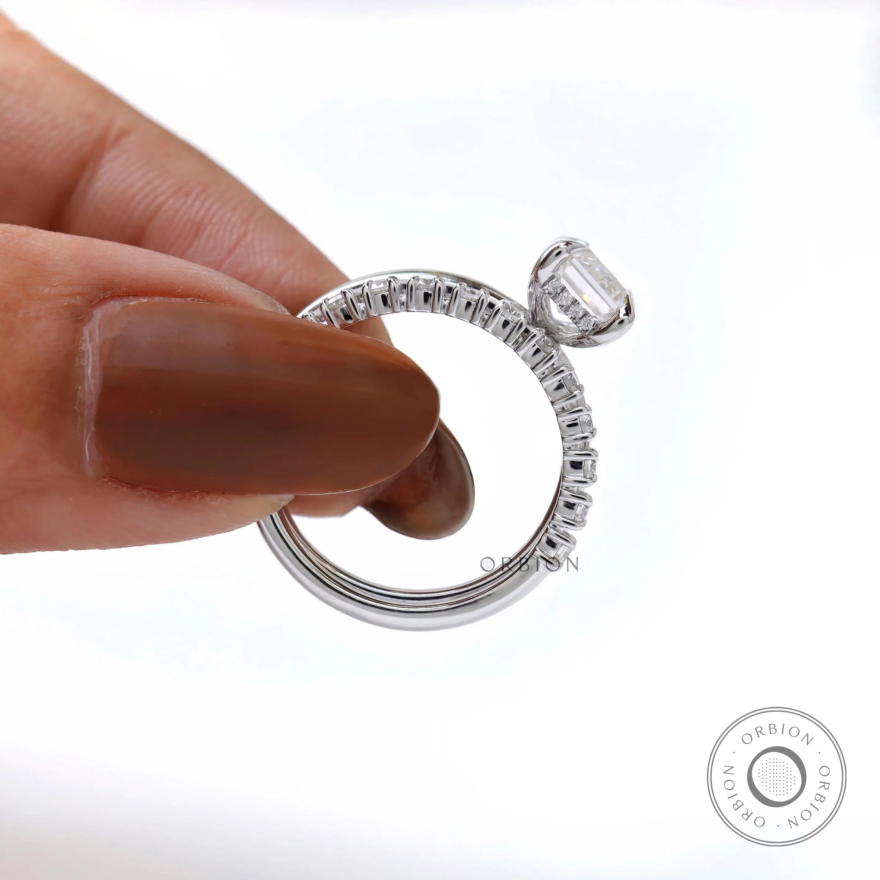 Pavé band emerald cut moissanite ring in white gold