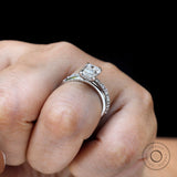Modern hidden halo ring with step cut center stone