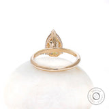 Back view of pear solitaire hidden halo ring