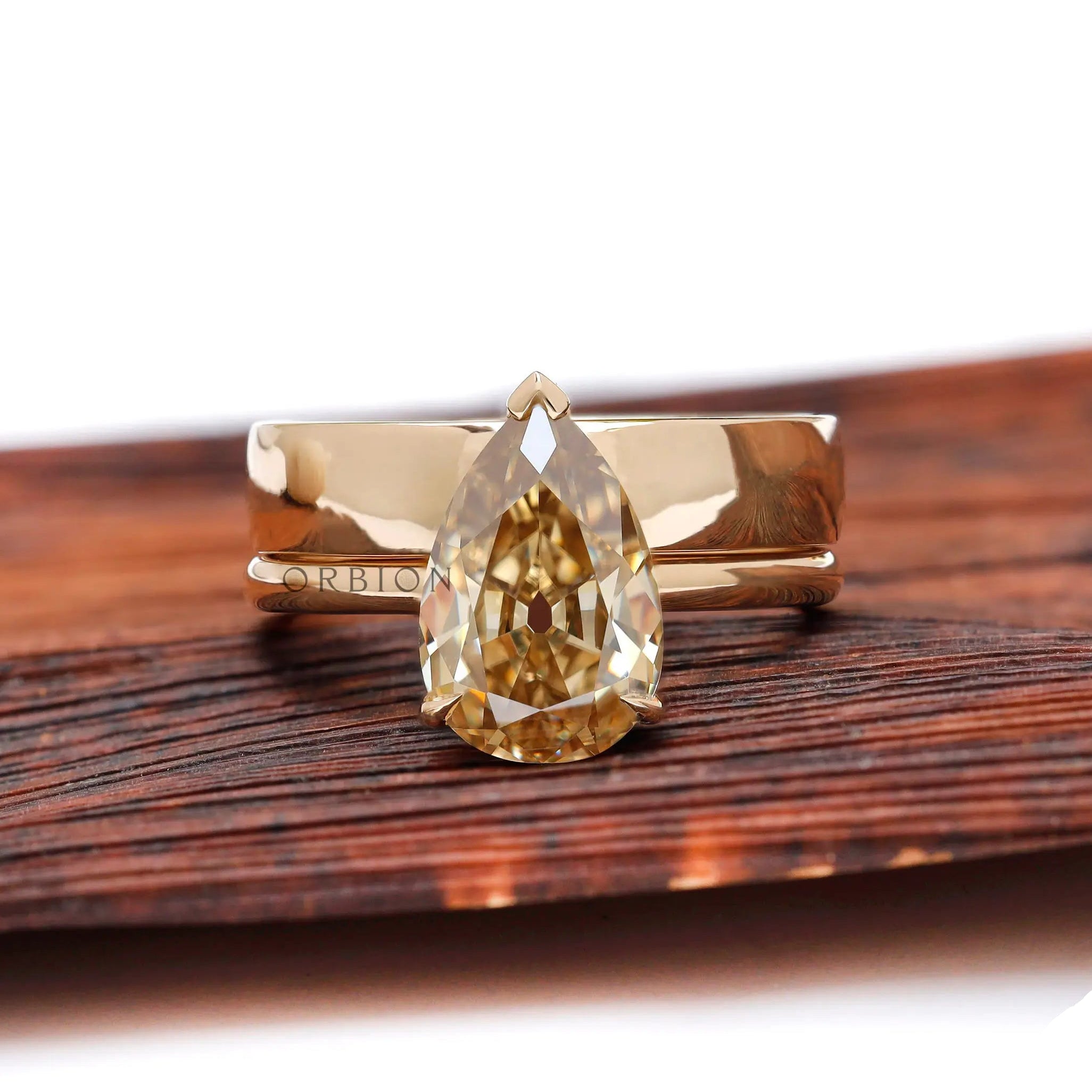 Pear Old Mine Cut champagne moissanite solitaire ring front view