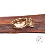 Side profile of pear champagne moissanite solitaire ring showing hidden halo