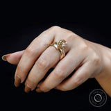 Pear champagne moissanite solitaire ring worn on hand top view