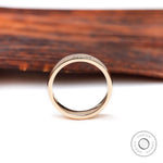 Front profile view of classic plain yellow gold wedding band with smooth rounded edges.