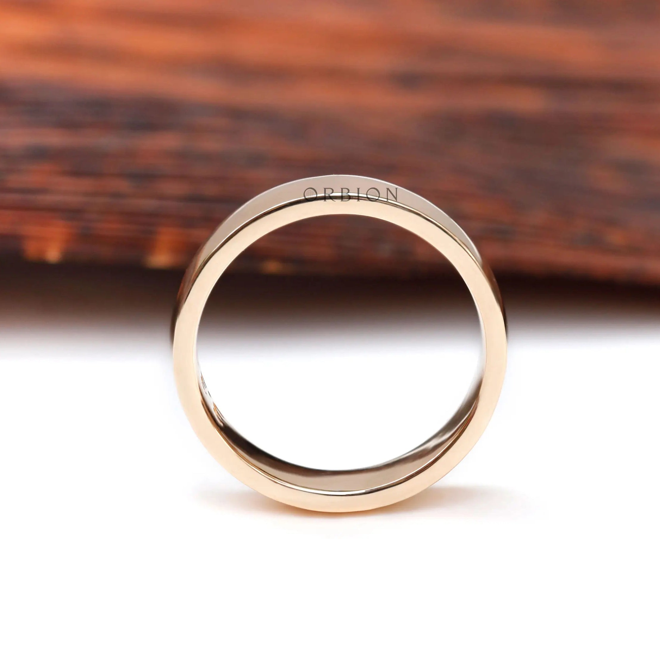 Front profile view of classic plain yellow gold wedding band with smooth rounded edges.