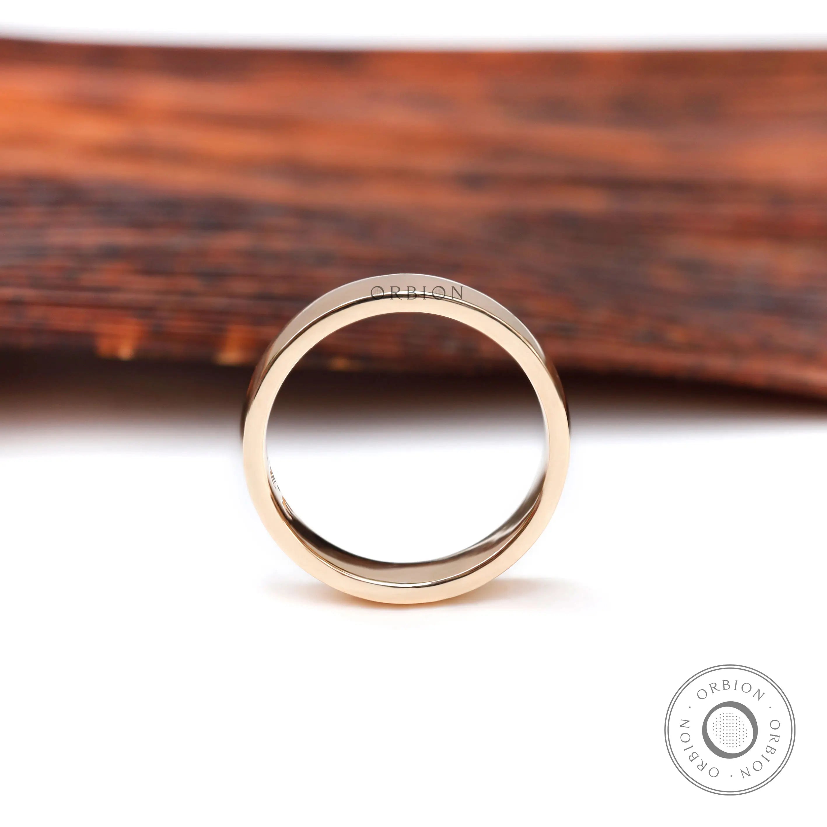 Front profile view of classic plain yellow gold wedding band with smooth rounded edges.