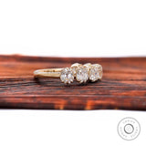 Angled side view of vintage style stacking band showing scalloped prongs.