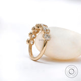 Three-quarter view of 7 stone half eternity ring highlighting vintage crown-style prongs and sparkle