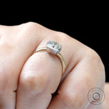 Cushion moissanite engagement ring worn on hand