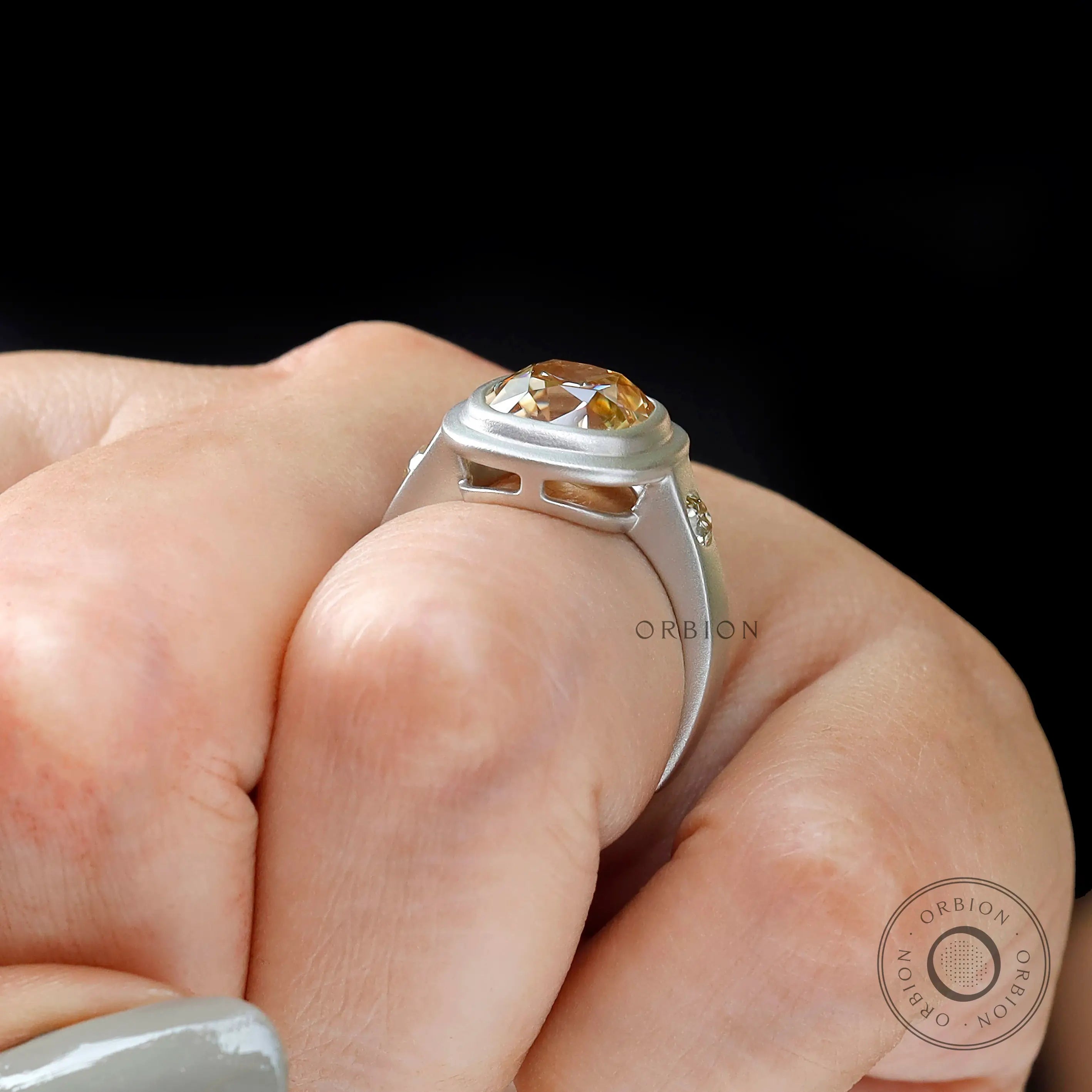 Side angle on hand showing chunky band and bezel gallery