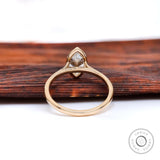 Underside view highlighting cathedral structure and bezel set marquise stone