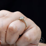 Side angle on-hand shot showing low profile bezel and cathedral design
