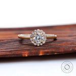 Front view round lab grown diamond with snowdrift cluster halo in yellow gold.