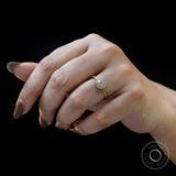 On-hand mid shot showing elegant scale and soft cluster sparkle.