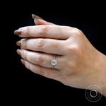 On-hand full view of round cluster engagement ring in 14K yellow gold.