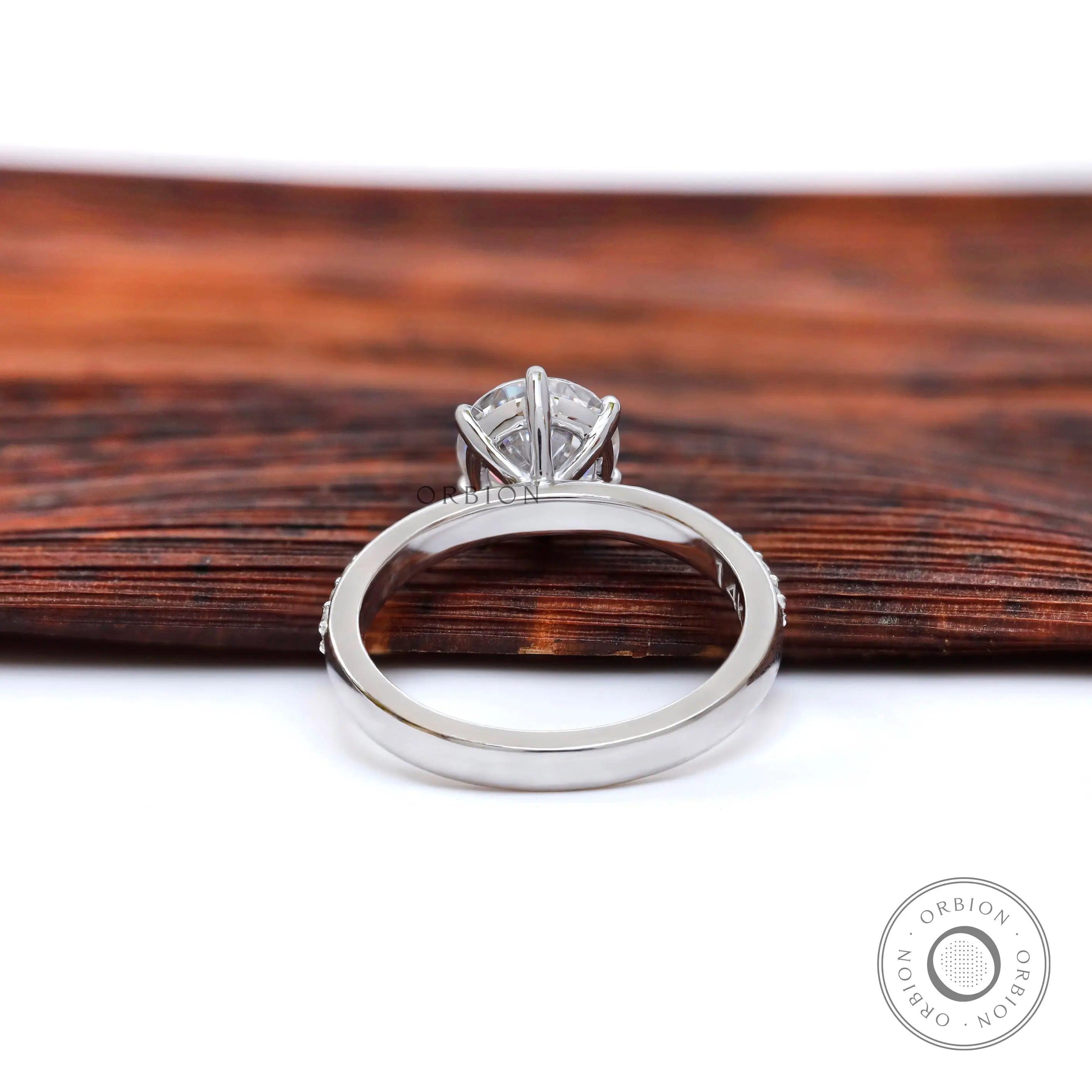 Back view of solitaire ring featuring open gallery and polished white gold shank.