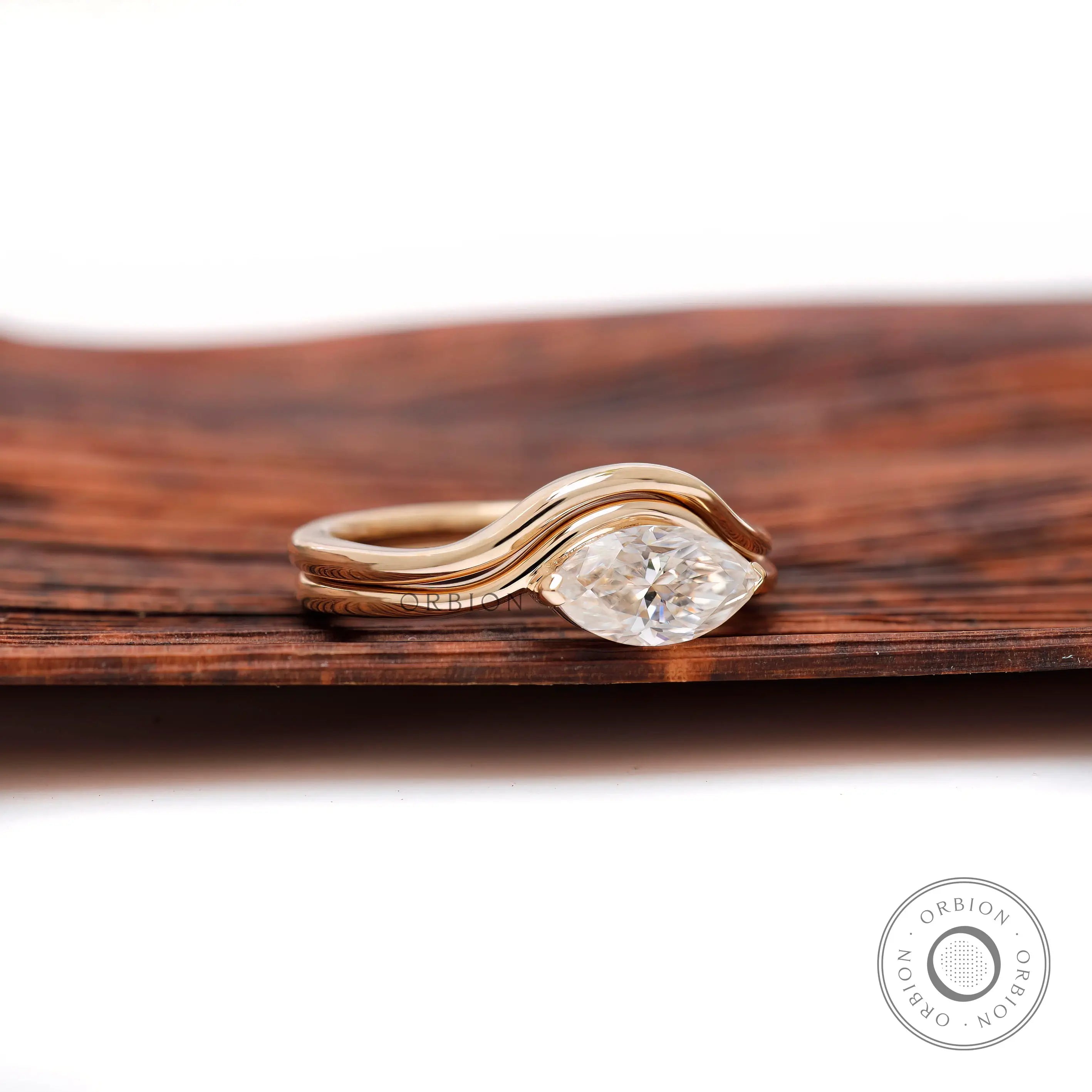 Wave band marquise cut moissanite ring side view