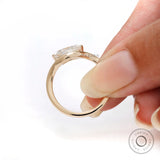 Marquise engagement ring with sculpted wave shank