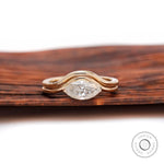 Marquise moissanite solitaire wedding ring set in yellow gold