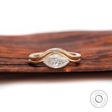 Marquise moissanite solitaire wedding ring set in yellow gold