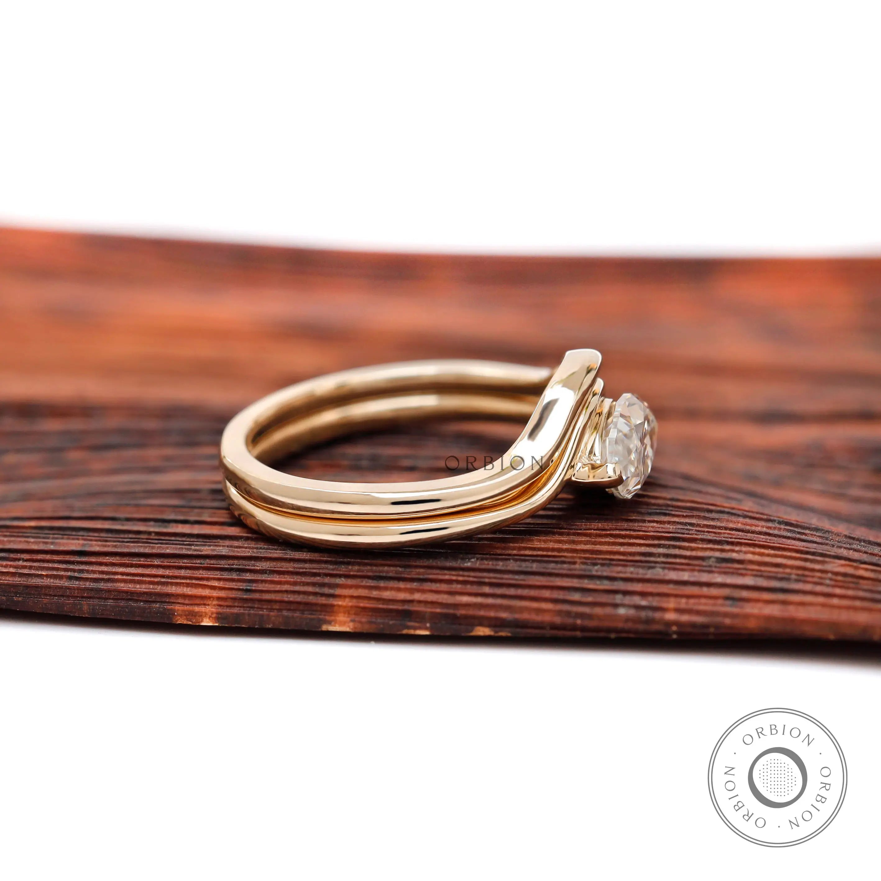 Low profile marquise solitaire ring in 10K yellow gold side view