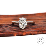 Oval lab grown diamond solitaire ring with cathedral setting in 14K white gold
