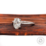 Oval brilliant cut diamond ring with hidden halo detail
