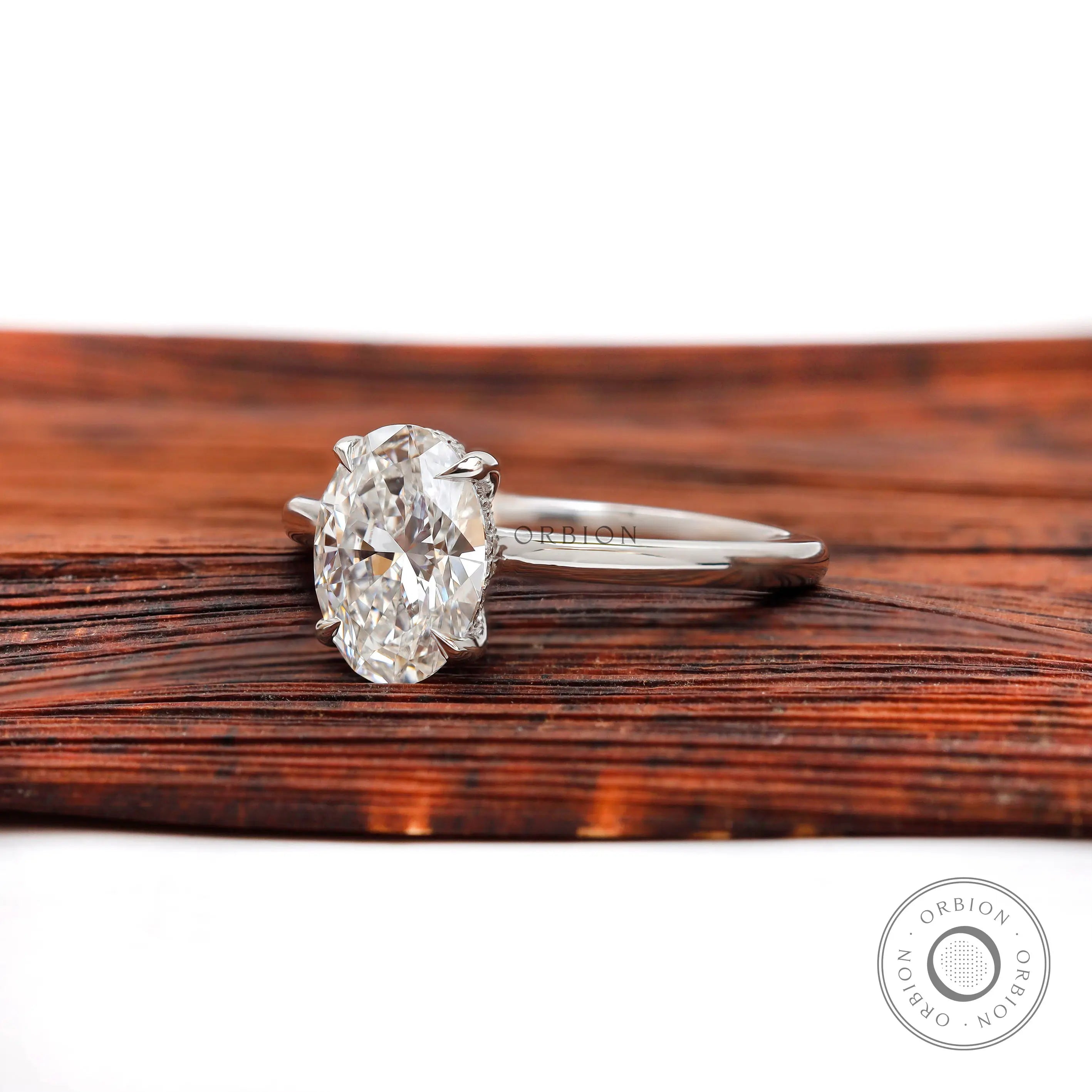 Oval brilliant cut diamond ring with hidden halo detail